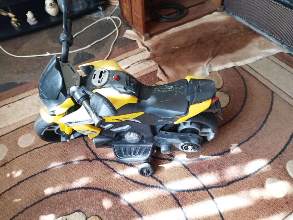 Yellow & Black Toddler Battery-Operated Ride-On Motorcycle (Plastic) – 1pc