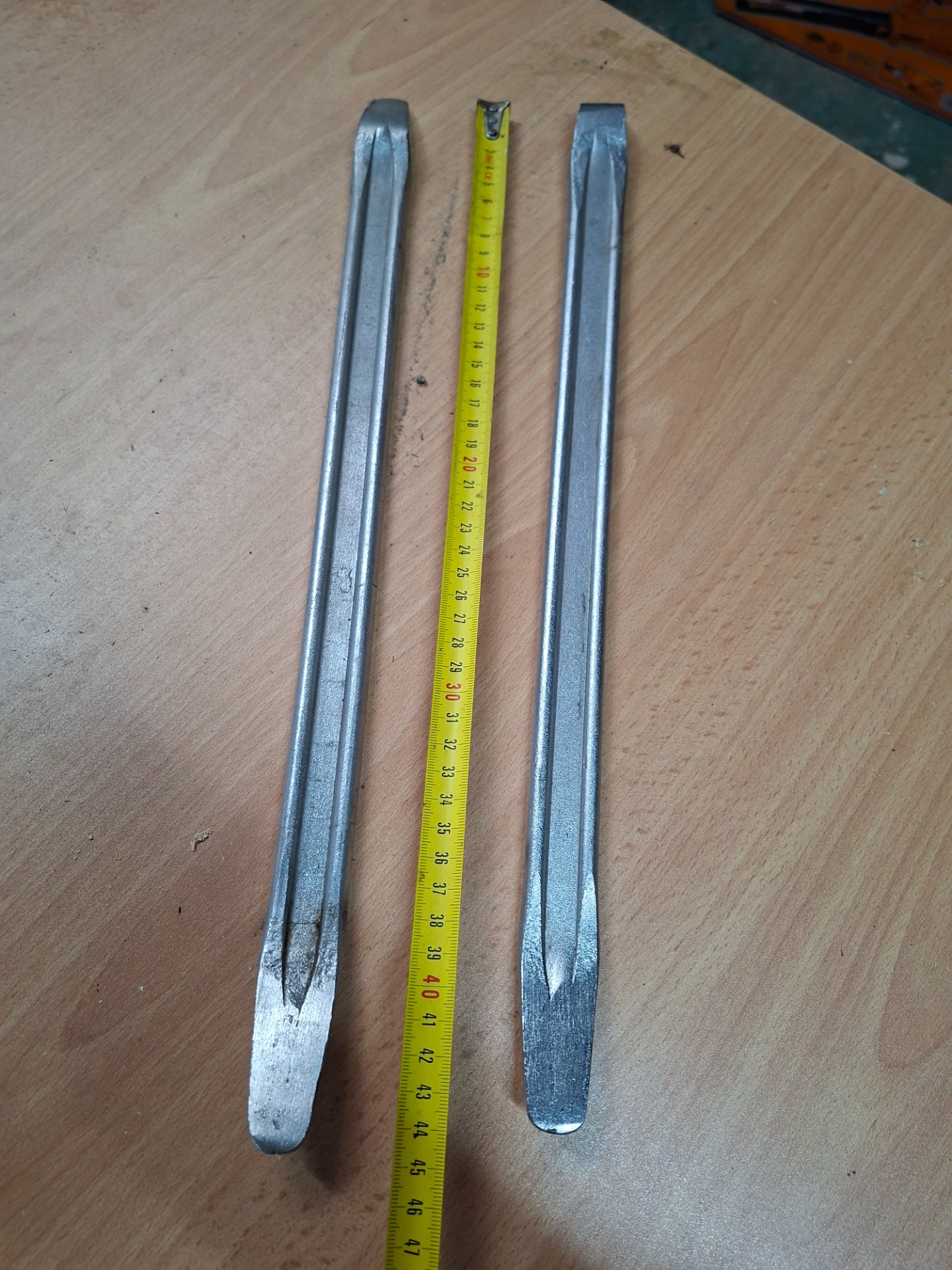 Pair of long metal pry bars / levers — approx 46–47 cm, used, light tip wear