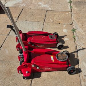 Pair of EuroTool 3.5 Ton Hydraulic Trolley Jacks – Working, One Seal Leaking