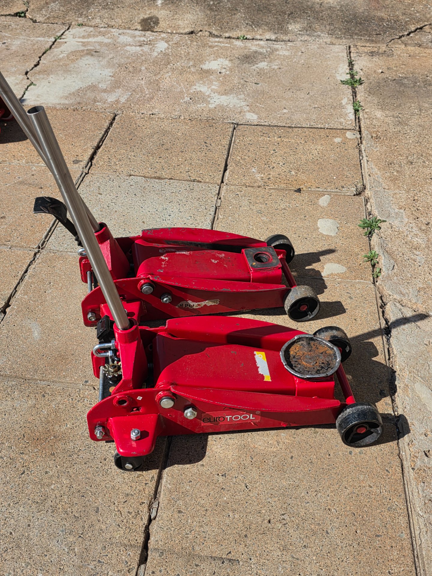 Pair of EuroTool 3.5 Ton Hydraulic Trolley Jacks – Working, One Seal Leaking