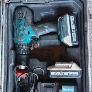 Makita cordless hammer drill kit with 2 batteries, charger, bits & case