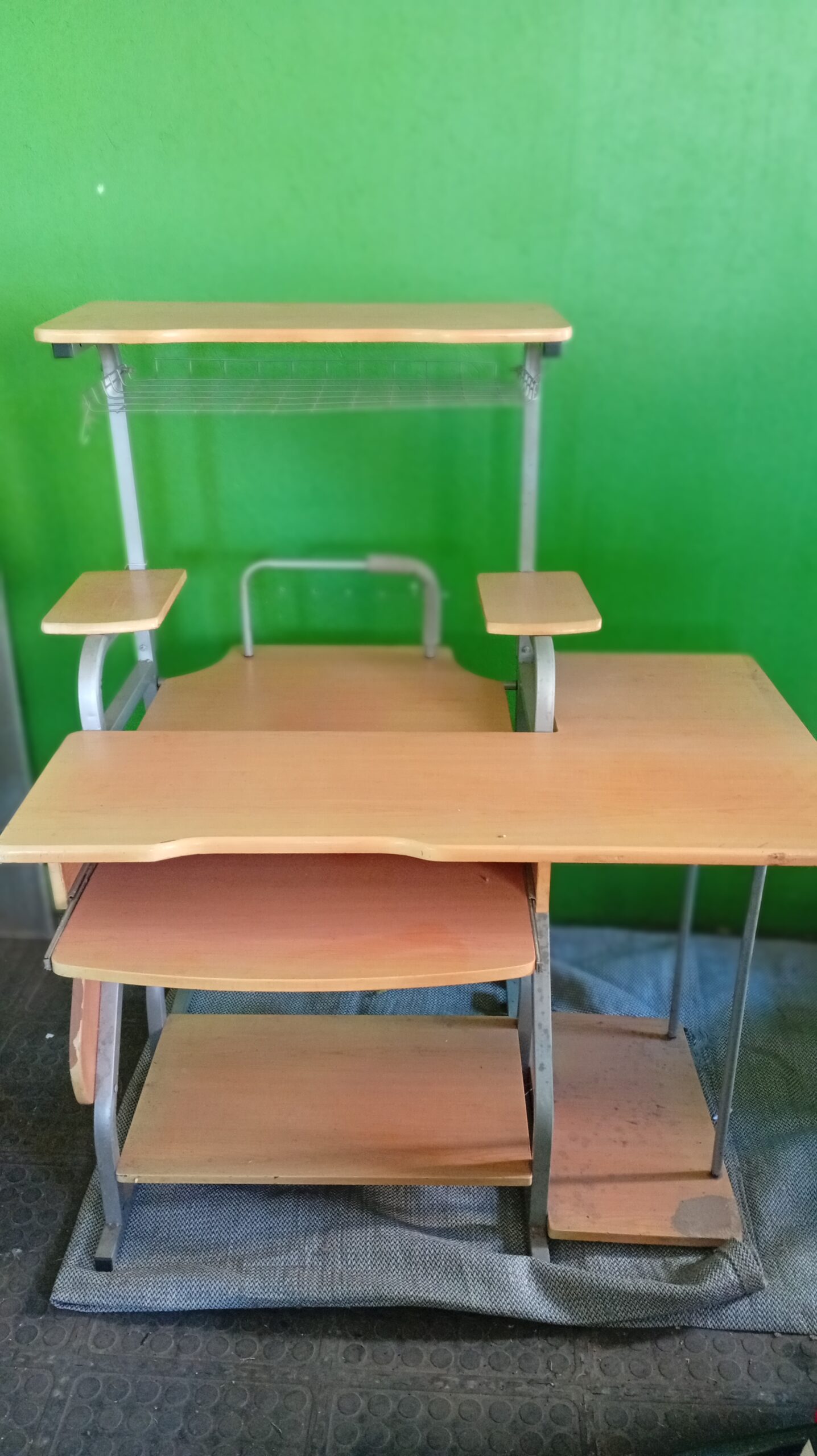 Large used computer office desk with multiple shelves and keyboard tray