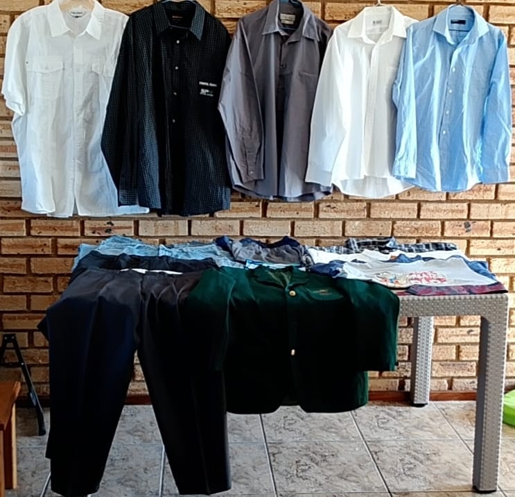 Mixed lot of 17 men’s shirts and trousers — used clothing bundle