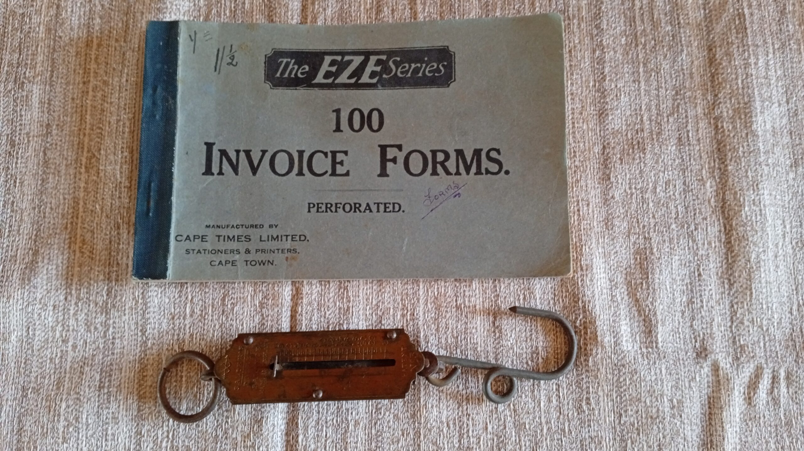 Vintage invoice/receipt book with handheld spring balance scale (pair)