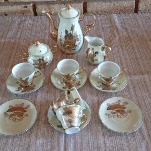 17-Piece Porcelain Tea Service (seller: matched teapot, creamer, sugar, cups & saucers)