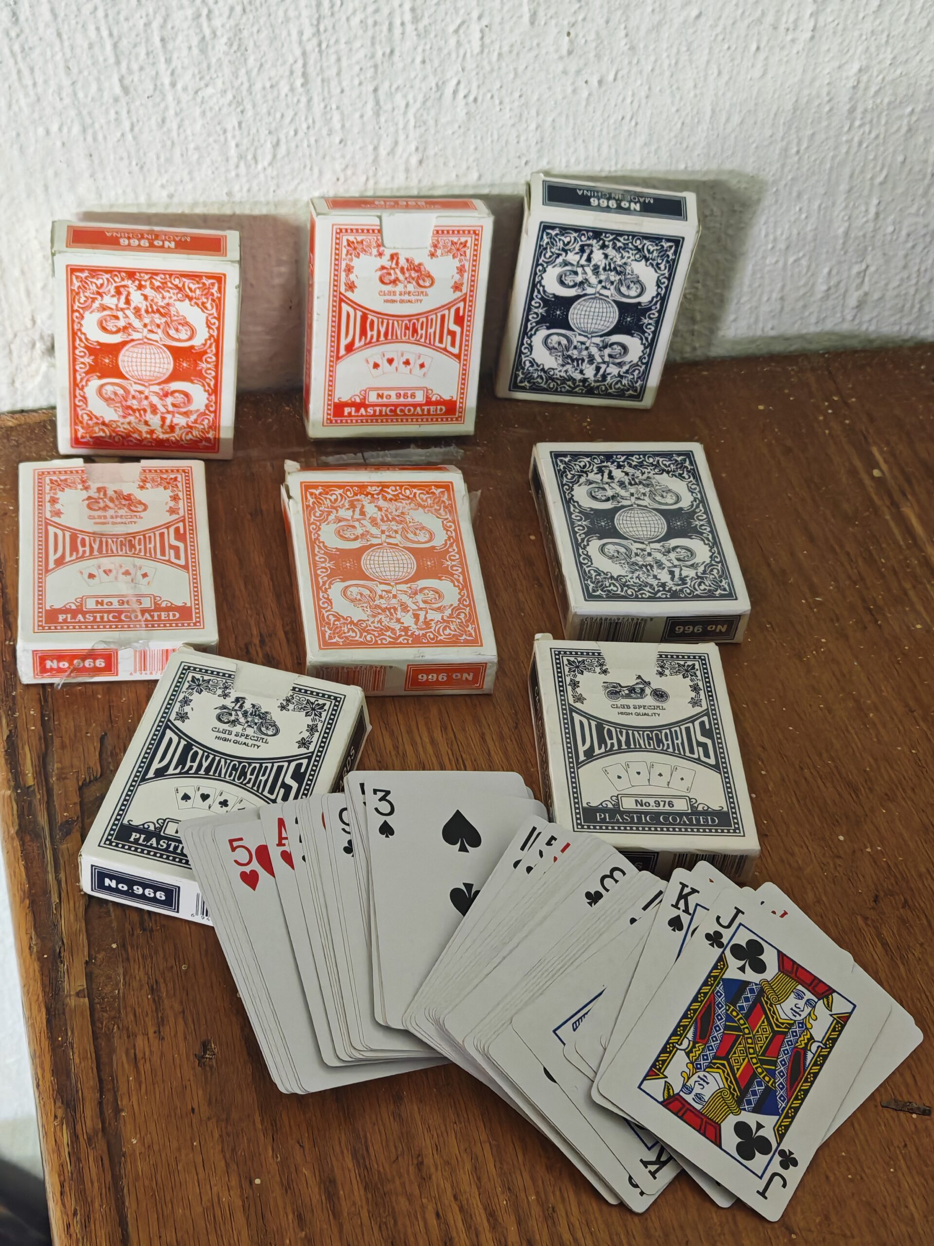 Bundle of ~8 Plastic-Coated Playing Card Decks (Mixed Red/Black Boxes)