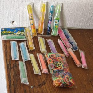 Mixed lot: approx. 17–19 sealed craft glitter/gel tubes + small glitter box & elastic bands