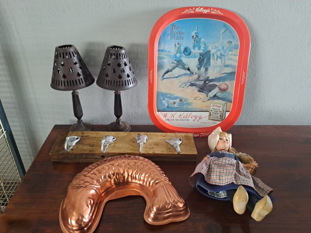 Mixed vintage lot: Kellogg’s advertising tray, Dutch milkmaid doll, copper mould & metal shades