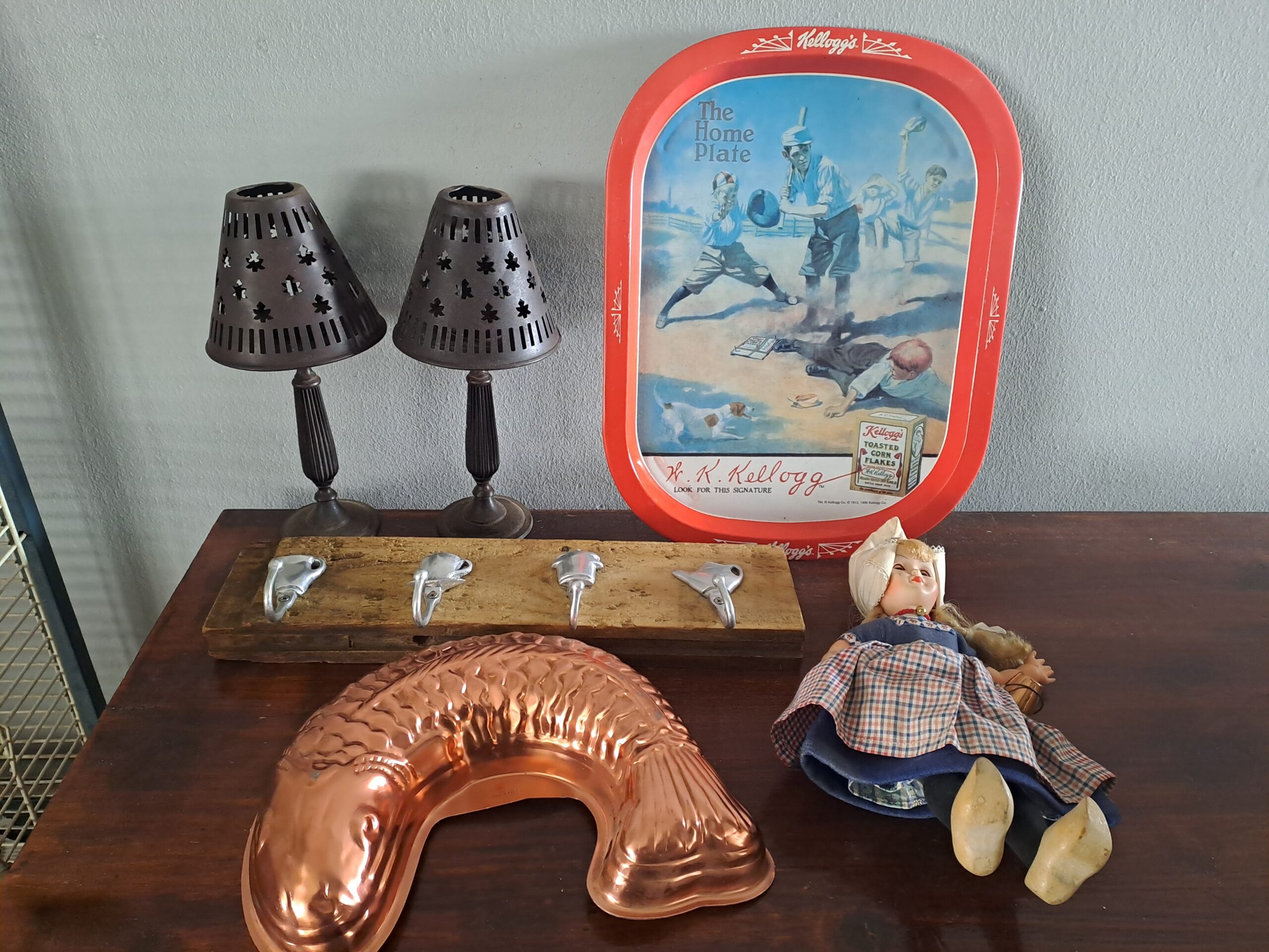 Mixed vintage lot: Kellogg’s advertising tray, Dutch milkmaid doll, copper mould & metal shades