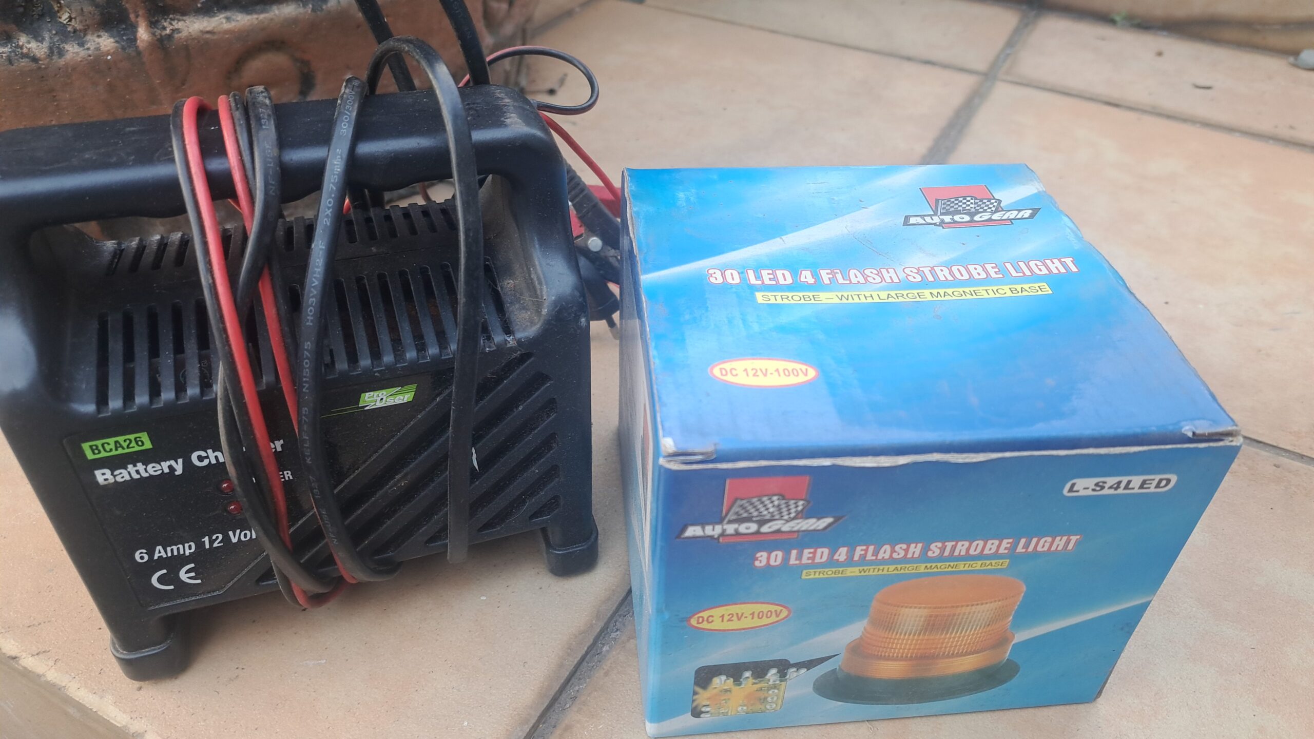 Battery Charger with Cables and Boxed 30-LED Strobe Light (2 items)