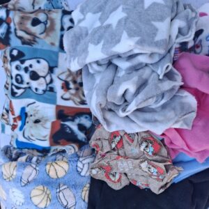 Lot of Assorted Used Fleece Blankets and Fabric Pieces