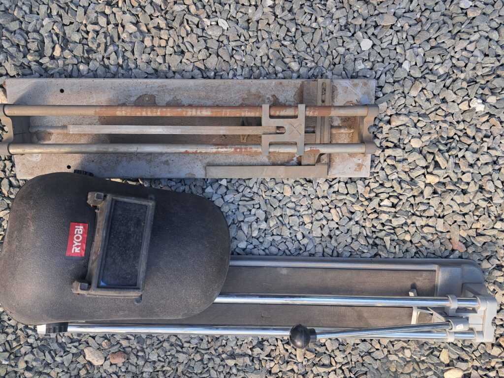 Pair of Manual Tile Cutters — 2x Set (one Ryobi, one heavily rusted)