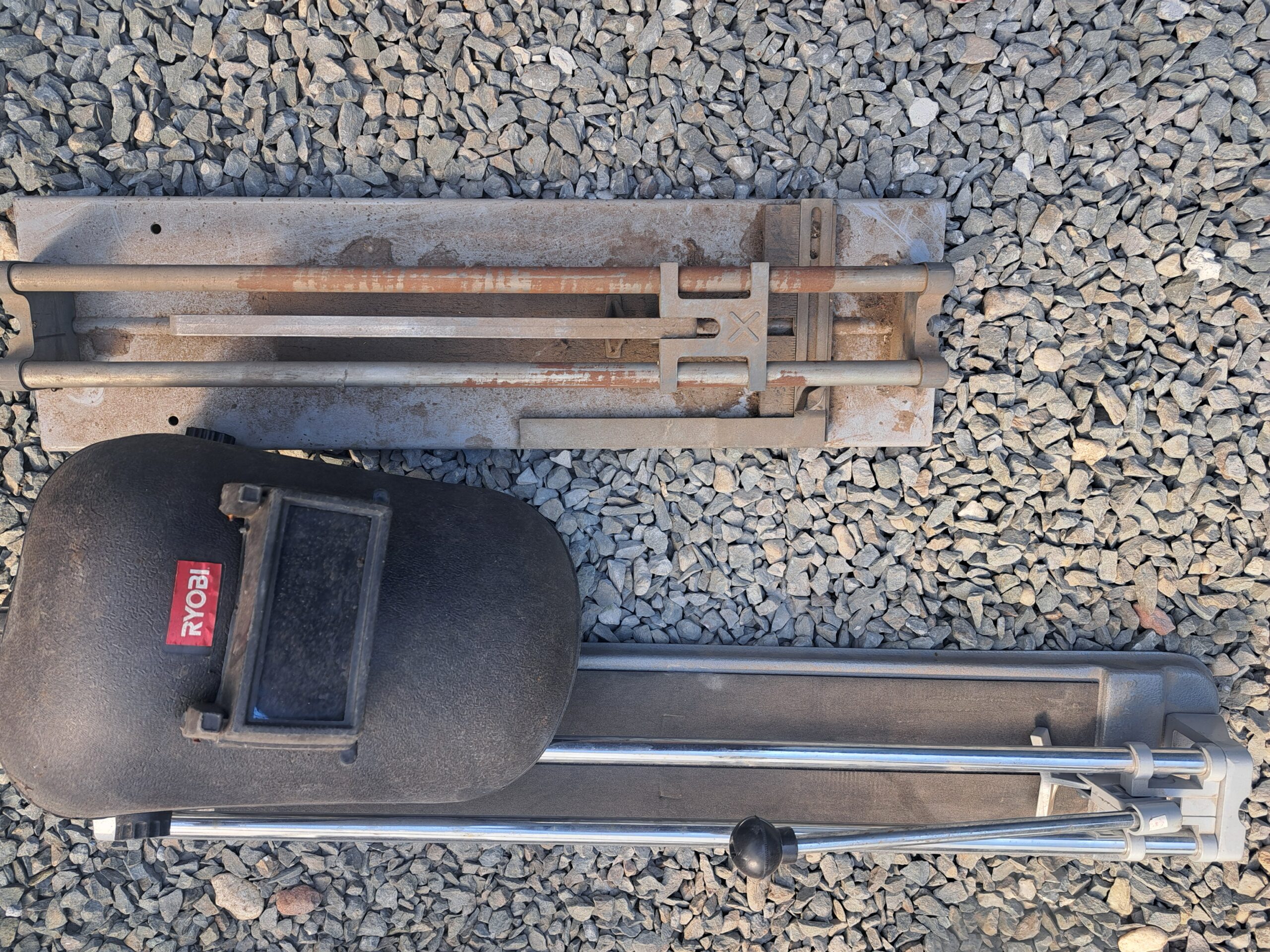 Pair of Manual Tile Cutters — 2x Set (one Ryobi, one heavily rusted)