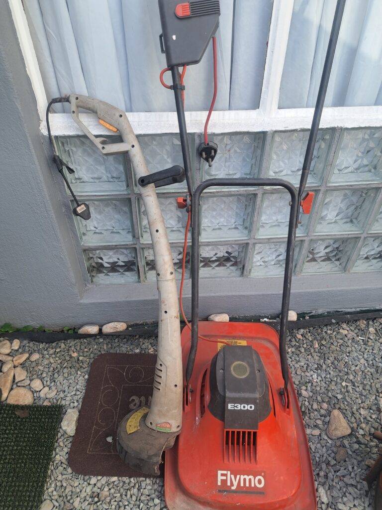 Flymo E300 electric lawn mower with electric line trimmer — 2-item garden tool bundle