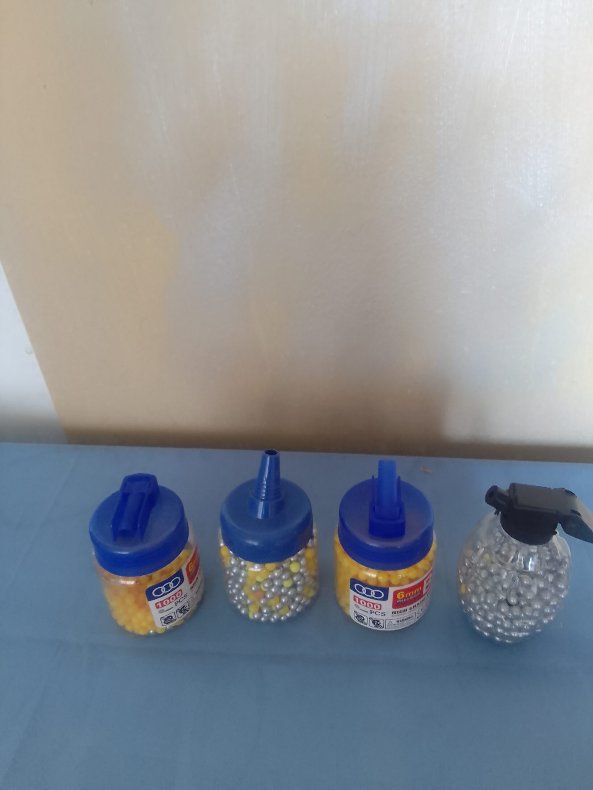 Lot of 4 Clear Containers of Airsoft BB Pellets (Mixed Colours)