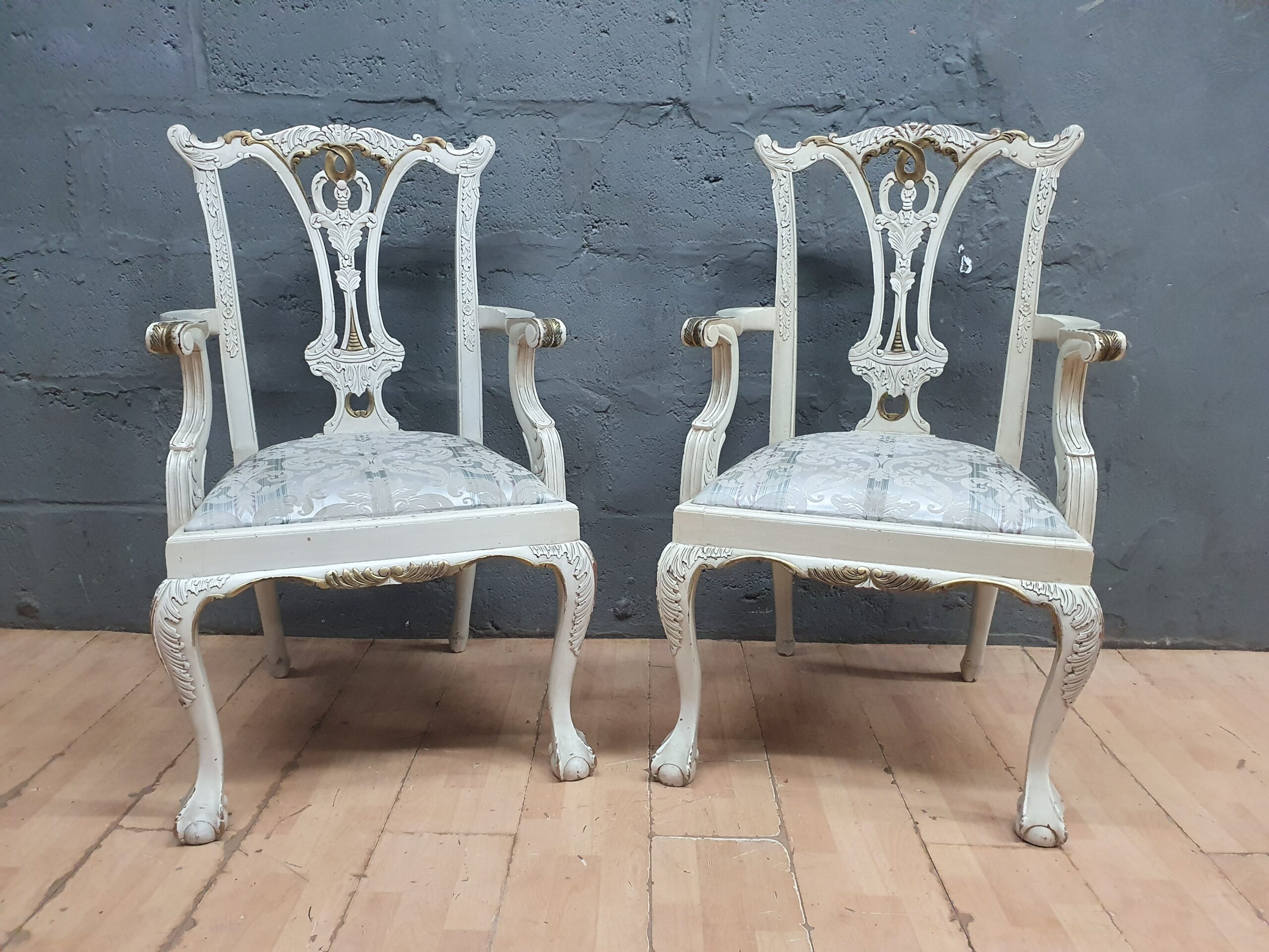Pair of White-Painted Upholstered Armchairs — Carved Backs & Armrests