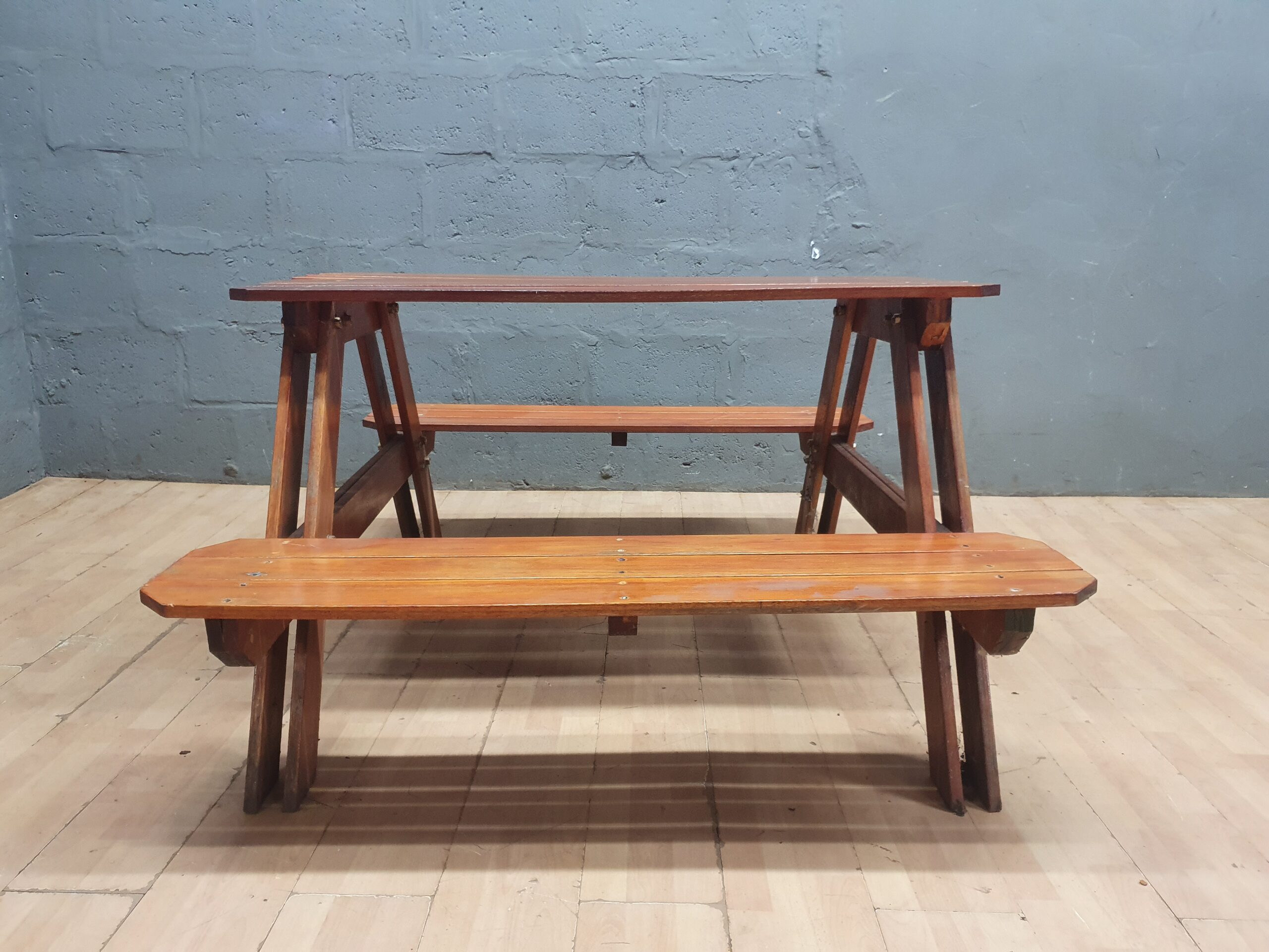 Wooden picnic-style table with attached benches — single, brown wood finish