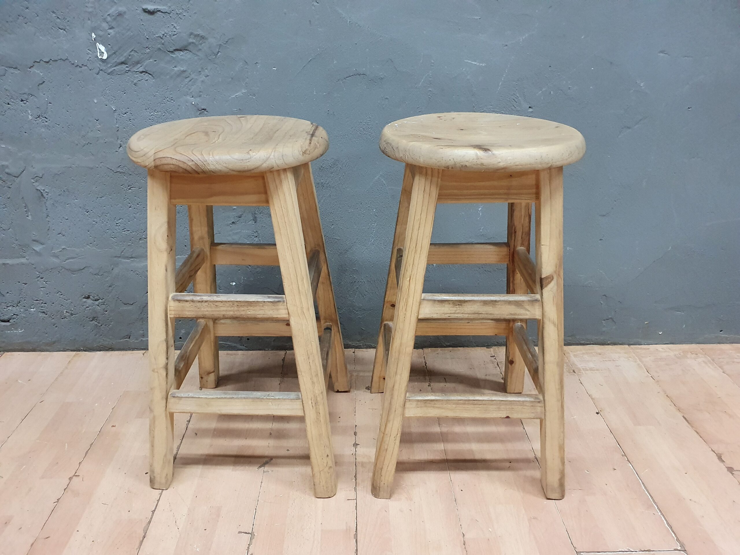 Pair of round-top wooden stools, light natural tone, 34cm dia x 68cm H (seller-measure)