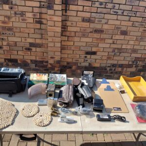 Table lot of mixed small household & camera items (approx. 20–30 pieces)