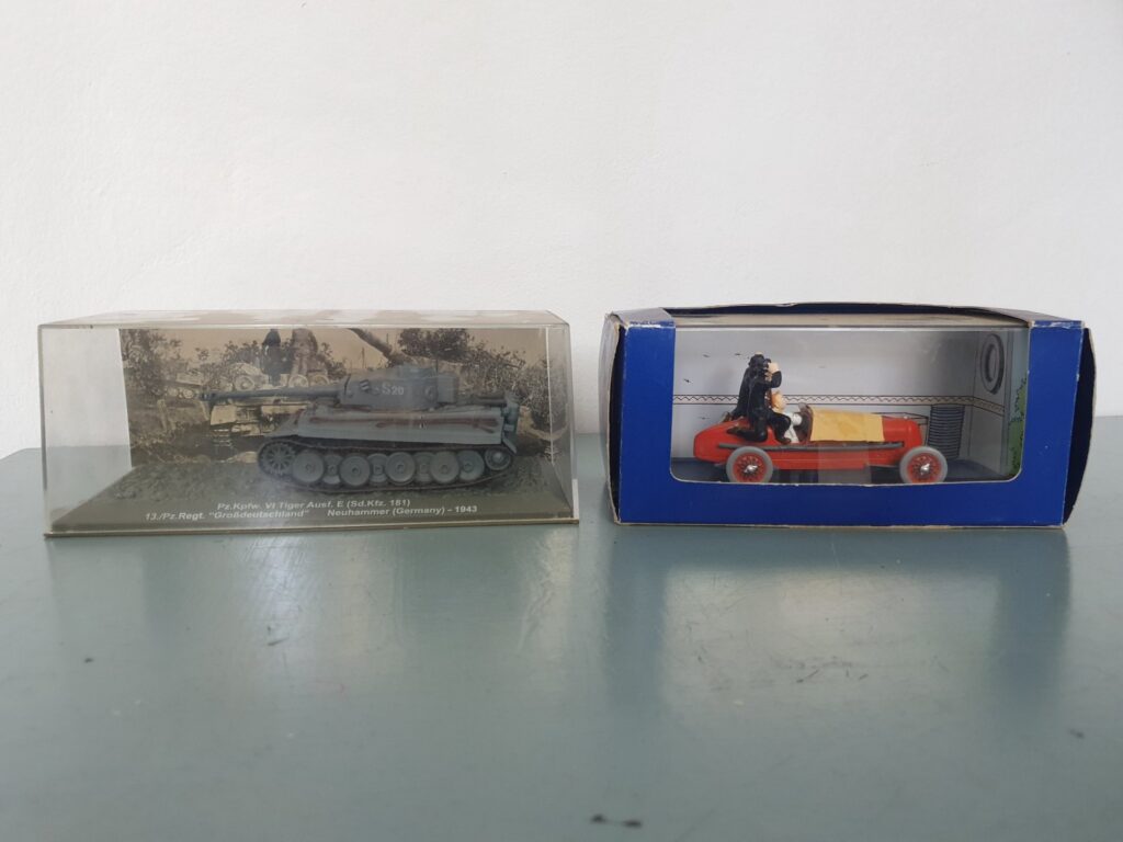 Two boxed display models — Pz.Kpfw. VI Tiger Ausf. E tank (display) & Tintin ‘Les Cigares du Pharaon’ red car