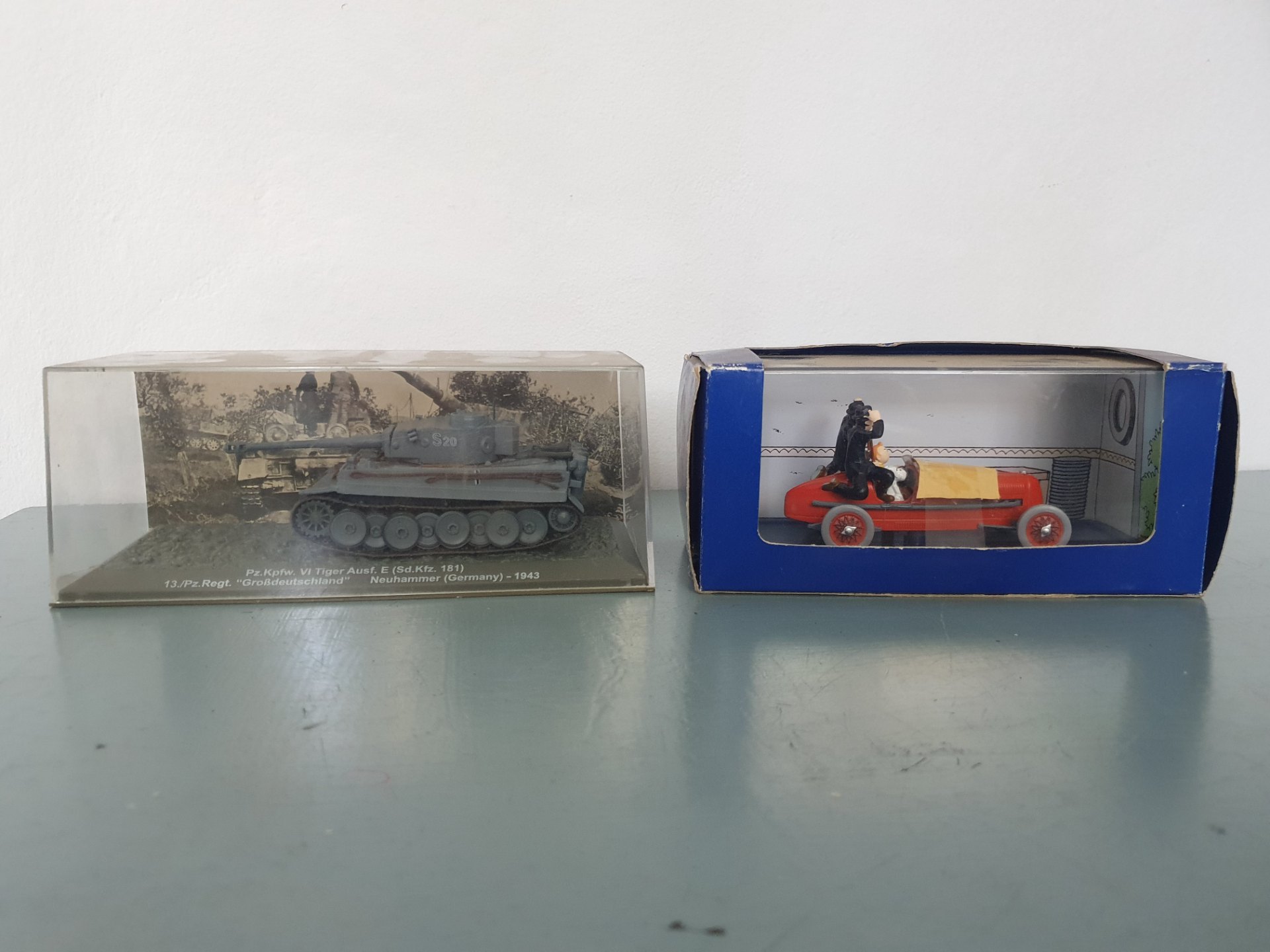Two boxed display models — Pz.Kpfw. VI Tiger Ausf. E tank (display) & Tintin ‘Les Cigares du Pharaon’ red car