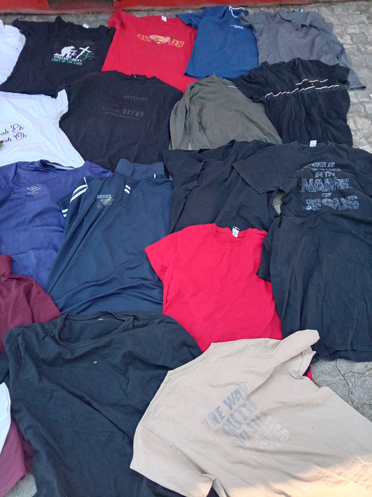 Mixed lot of used men’s & women’s T-shirts, polos and tops — casual wear, visible wear & stains