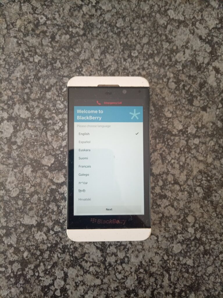 BlackBerry smartphone – boots to setup screen, white textured rear, rear-cover crack, untested