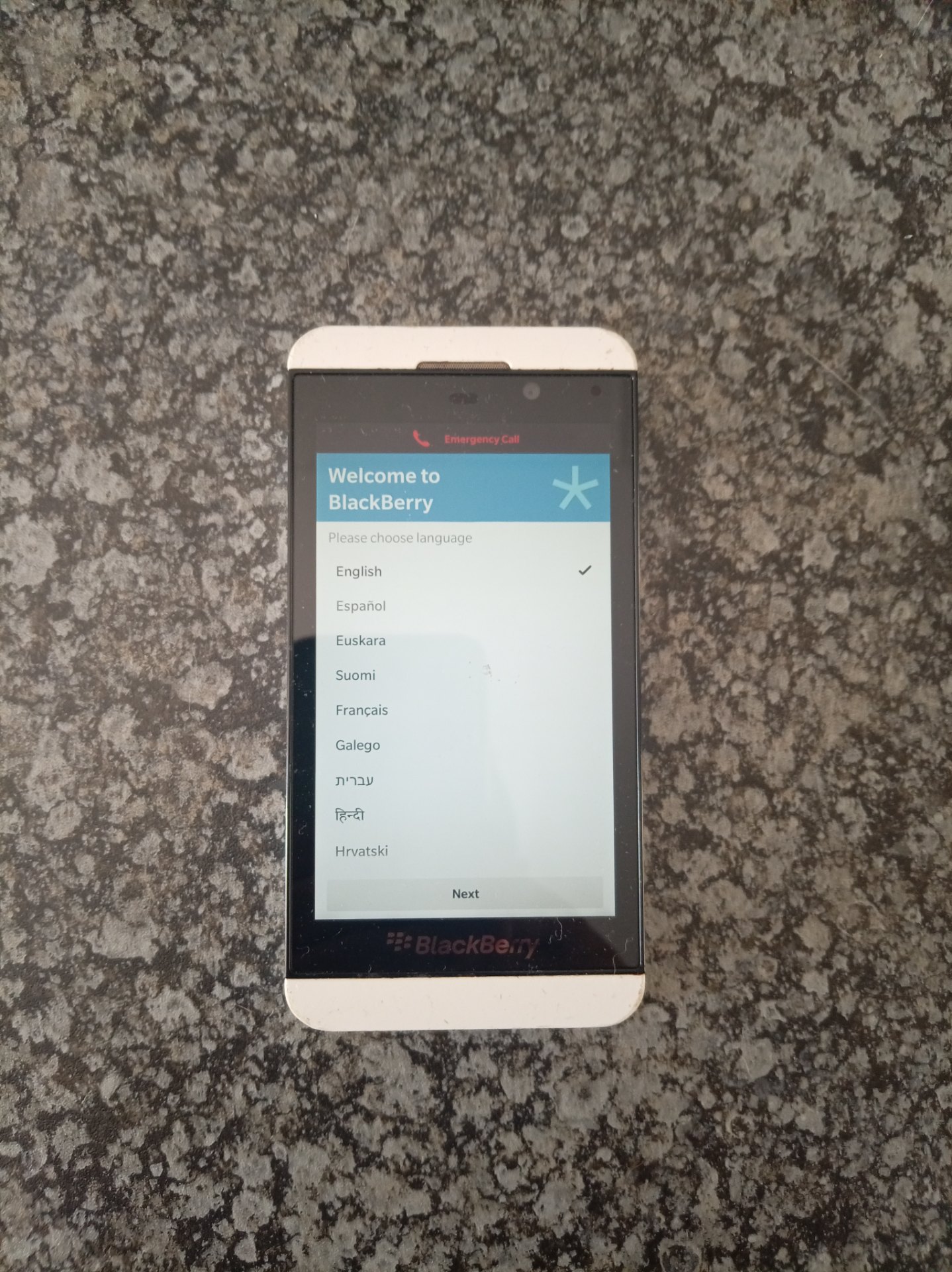 BlackBerry smartphone – boots to setup screen, white textured rear, rear-cover crack, untested