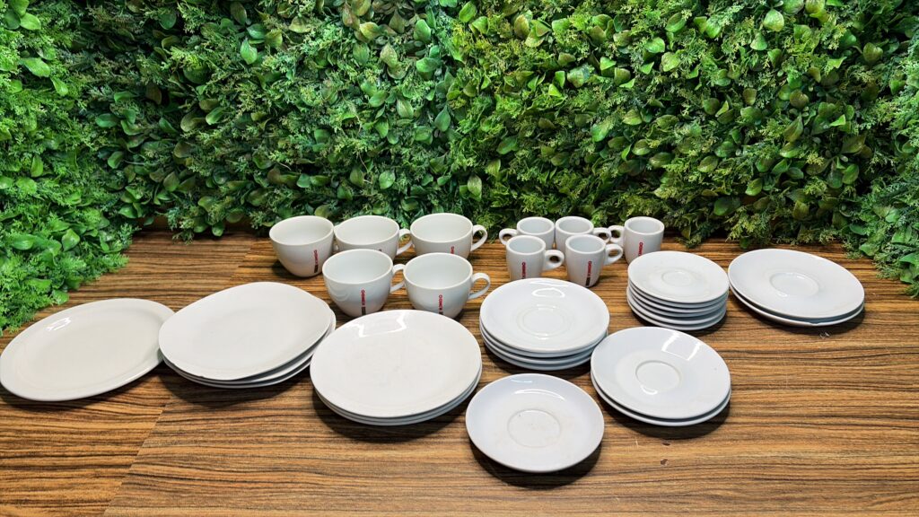 Mixed lot of white plates, saucers & mugs — approximately 25 pieces
