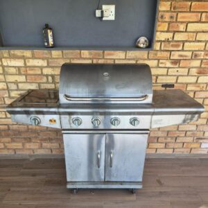 Stainless-steel 4-burner LPG gas braai with side burner and rotisserie spit (working, needs clean)