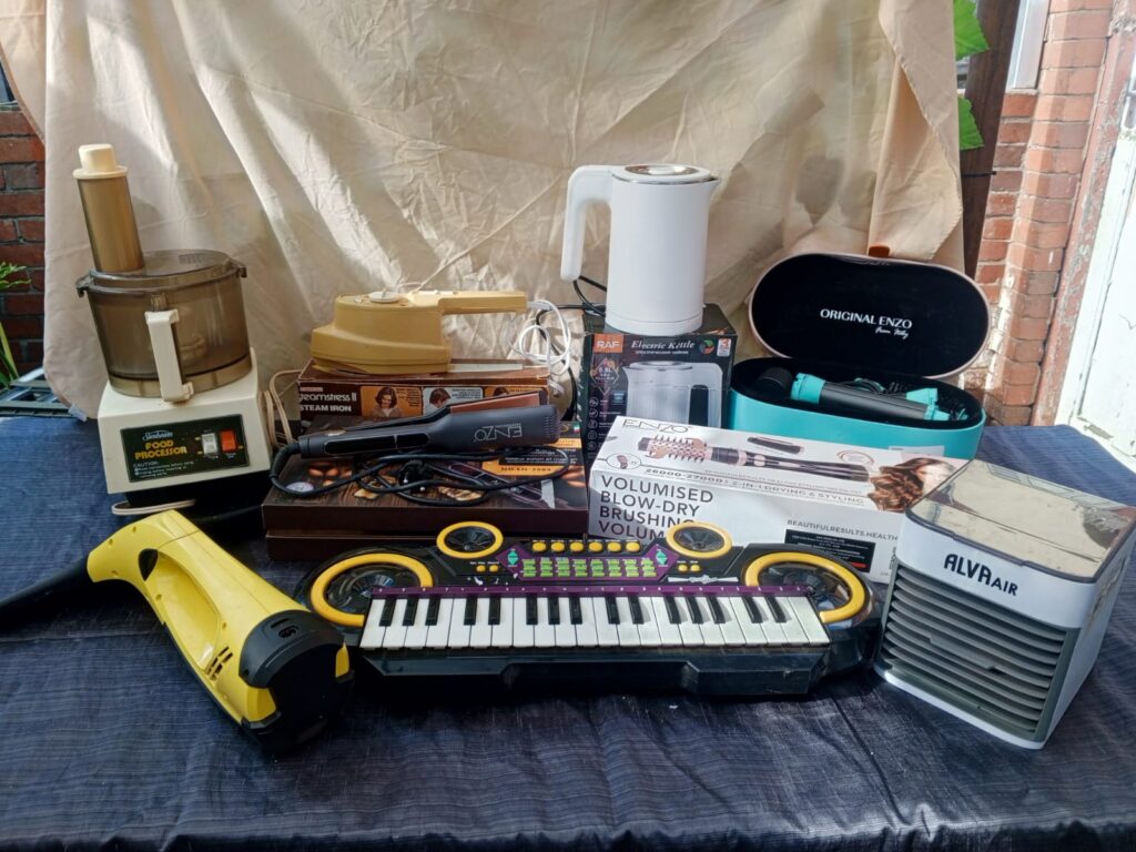 Mixed lot of small appliances & electronics (9 visible) — sold as-is, for parts/repair