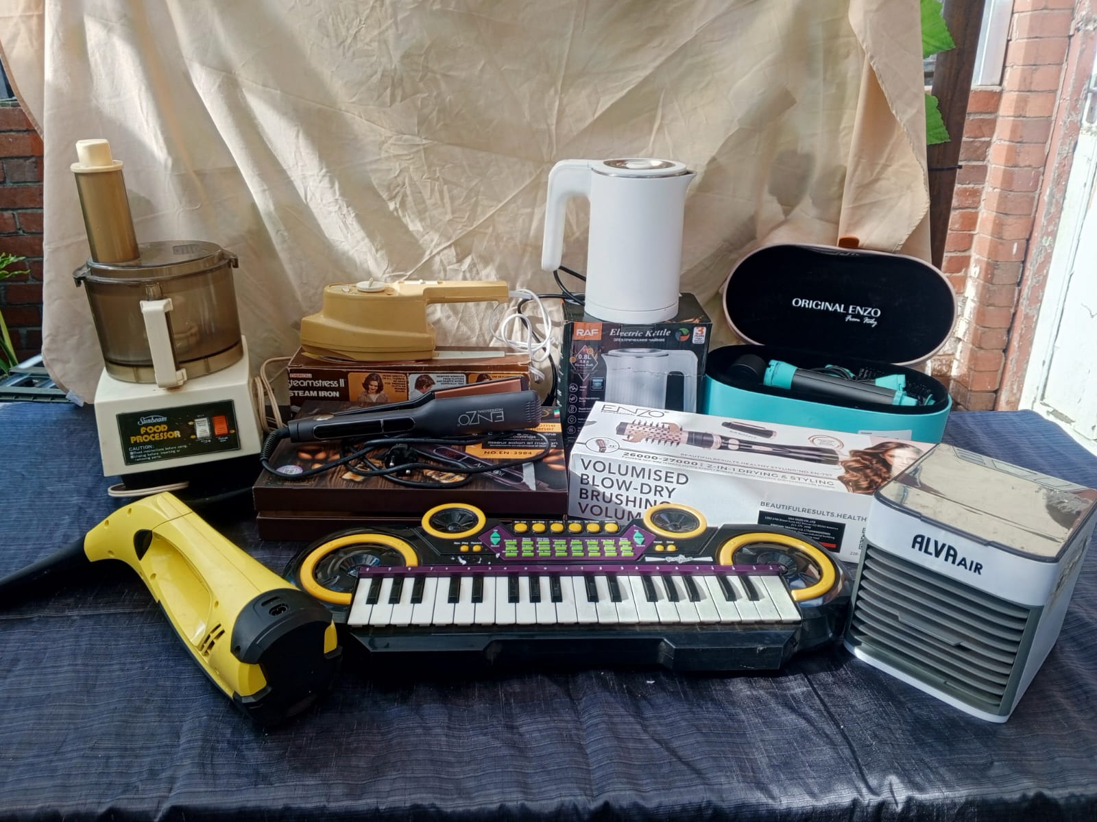 Mixed lot of small appliances & electronics (9 visible) — sold as-is, for parts/repair