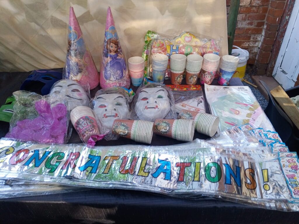 Mixed Lot of New Party Supplies – Cups, Hats, Banners, Masks & Signs