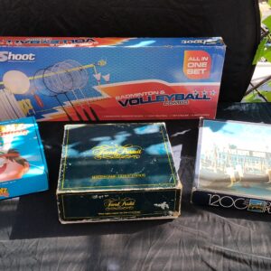 Mixed lot of 4 boxed games and a 1200-piece puzzle