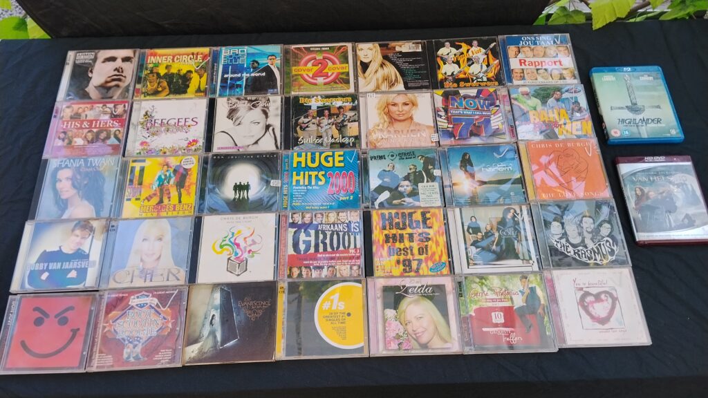 Mixed lot of approx. 37 music CDs with 2 video discs — assorted covers in jewel cases