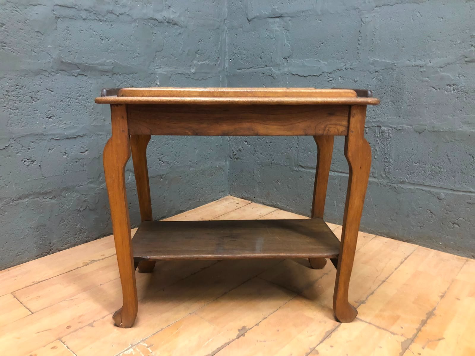 Victorian-style wooden occasional / side table with lower shelf — used, solid