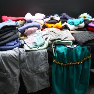 Mixed lot of 25+ used clothing — men's, women's & children's (folded assortment)