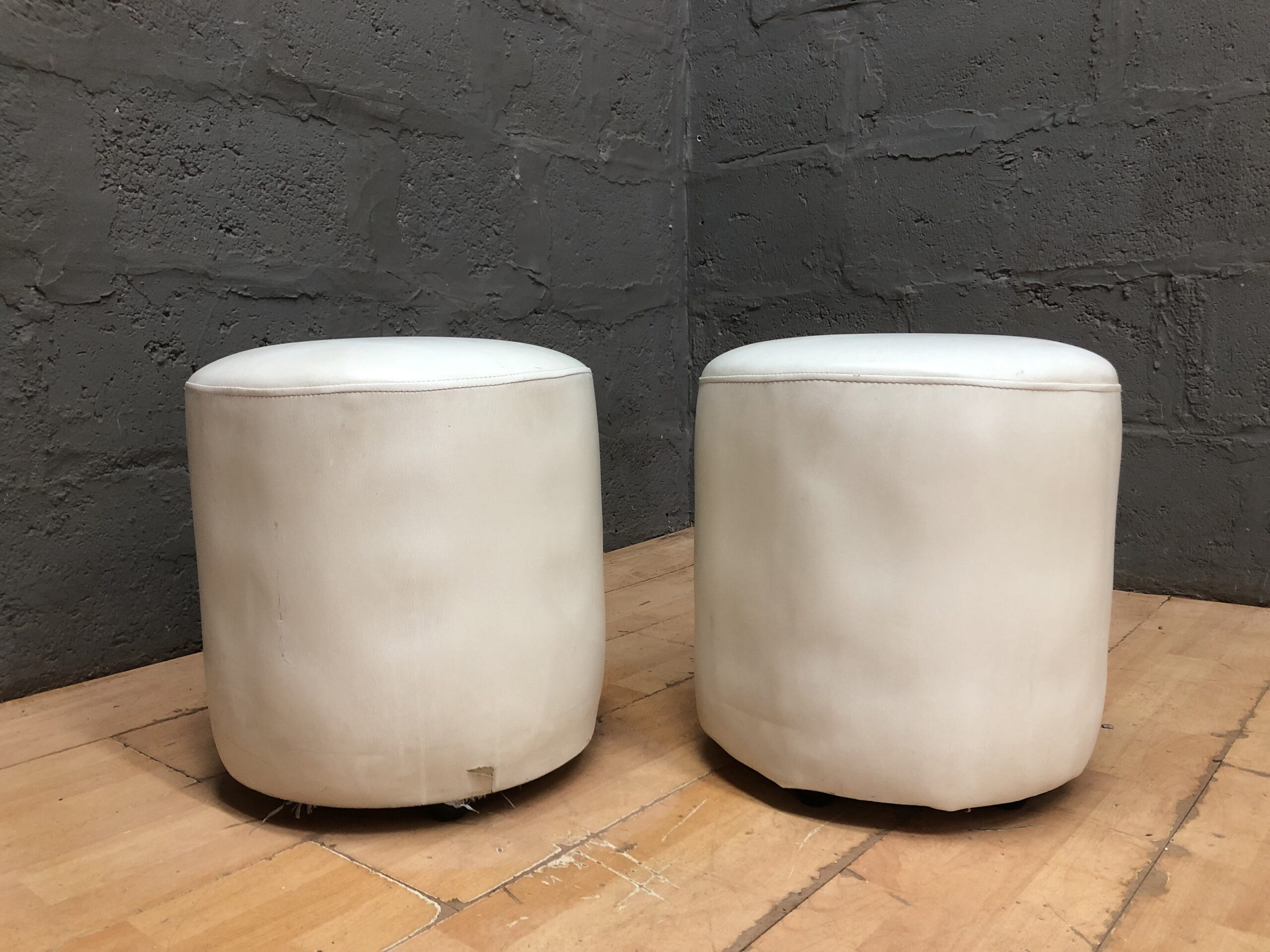 Pair of Small Round Off-White Ottomans / Poufs — Visible Tear & Stains