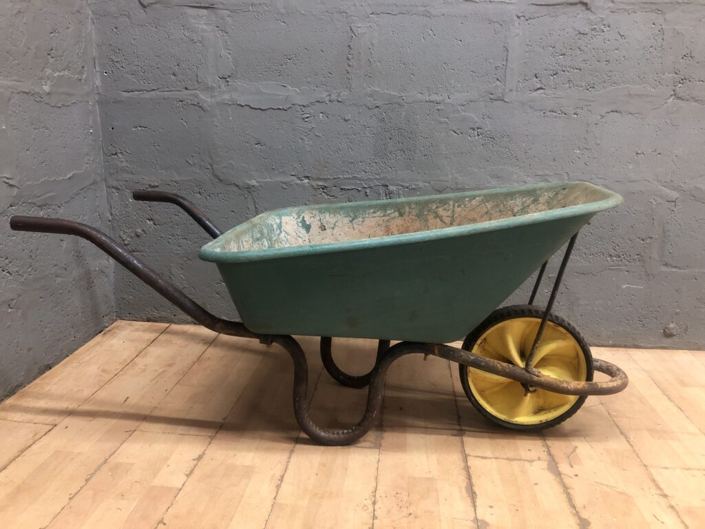 Used Single-Wheel Wheelbarrow — Green Tub, Rusted Metal Frame