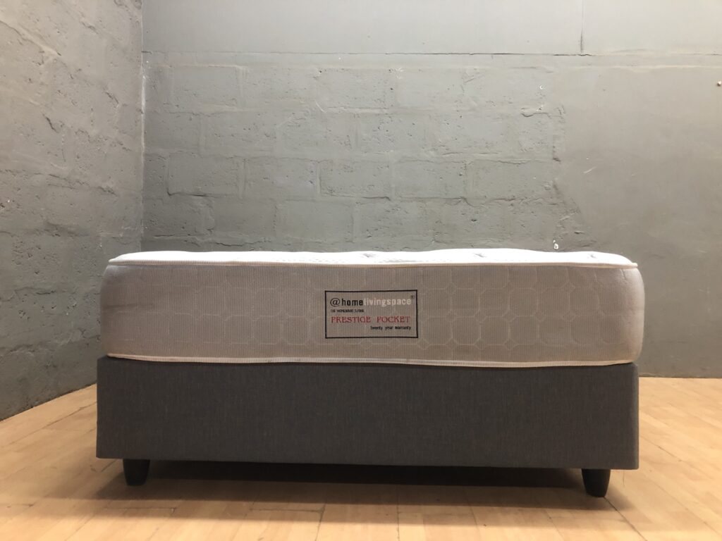 Queen-size mattress with fabric-covered base / divan (labelled @home livingspace)
