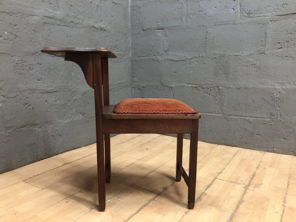 Single Wooden-Frame Chair with Attached Side Table and Orange Upholstered Seat