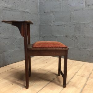 Single Wooden-Frame Chair with Attached Side Table and Orange Upholstered Seat