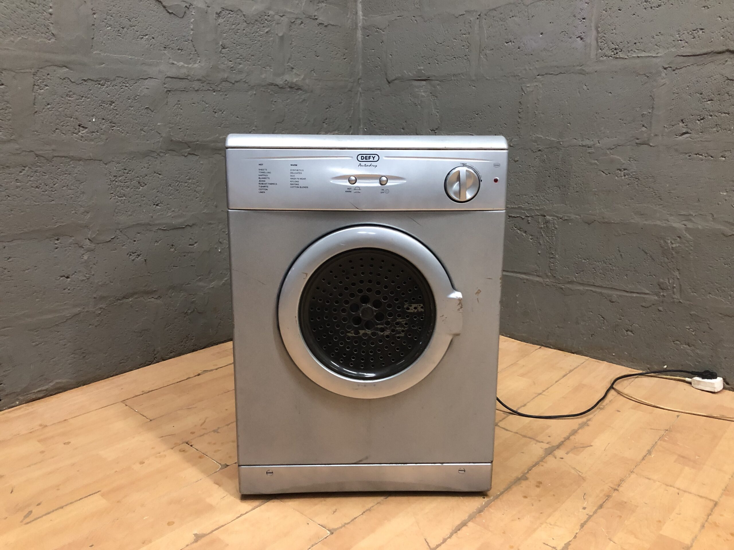 Defy Silver Front-Loading Clothes Dryer — Single Unit, Door & Power Cord Present