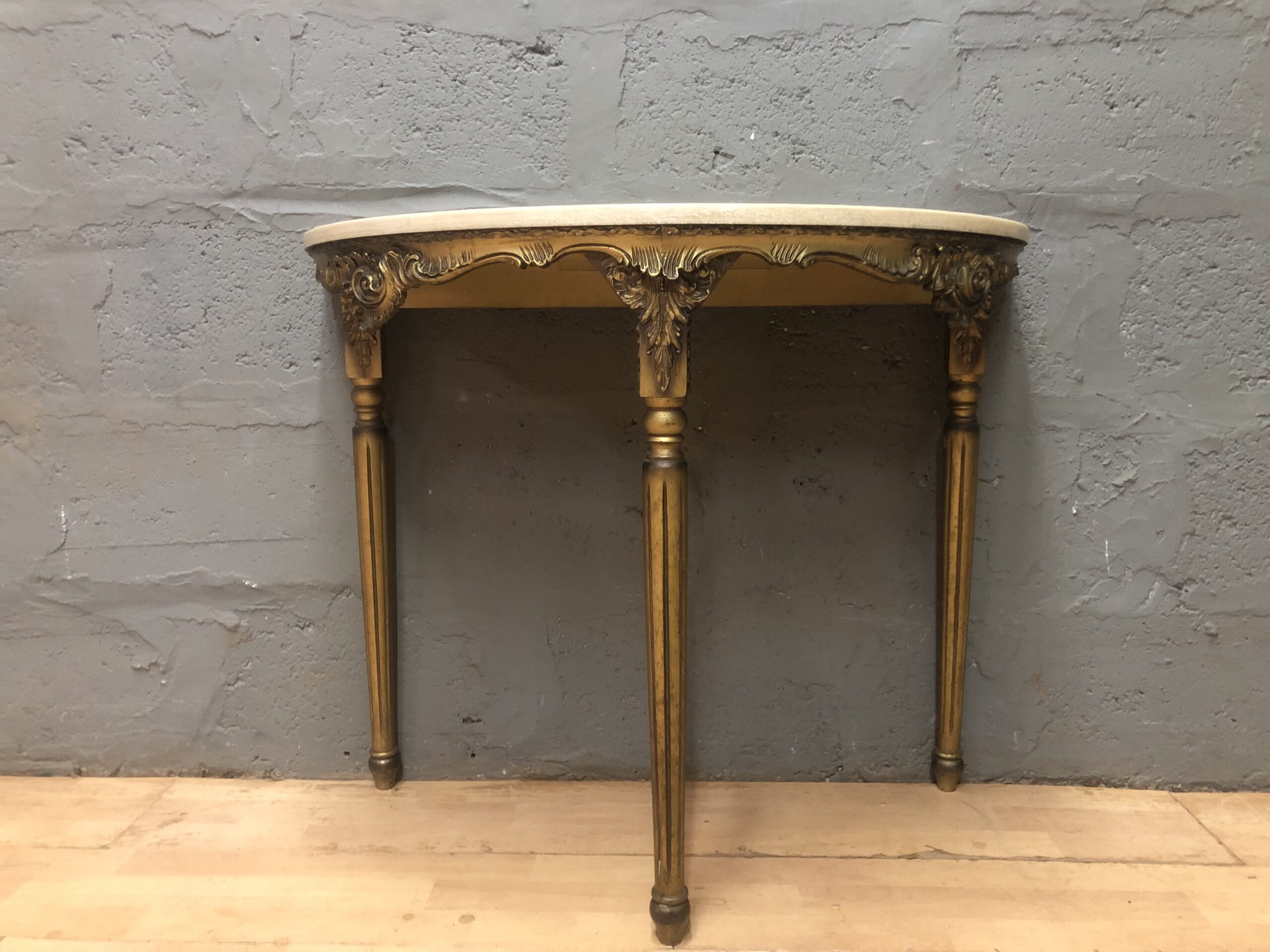 Demi-lune (half-moon) gilt console table with cream top — 1 piece