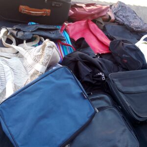 Lot of assorted bags and small suitcases – mixed colours, visible wear