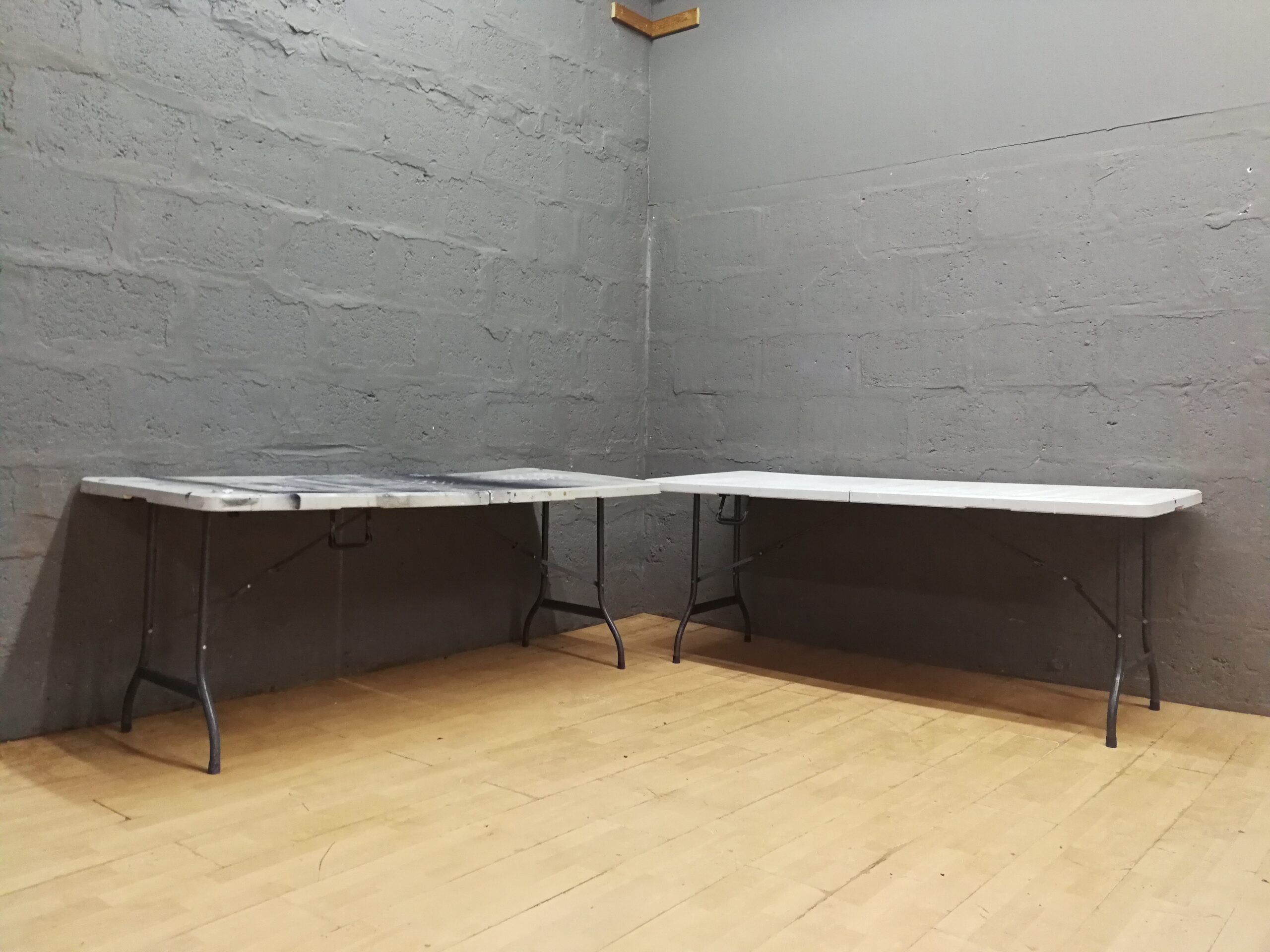 2 x Folding rectangular tables with hinged centre – heavy surface damage, 177×74×73cm