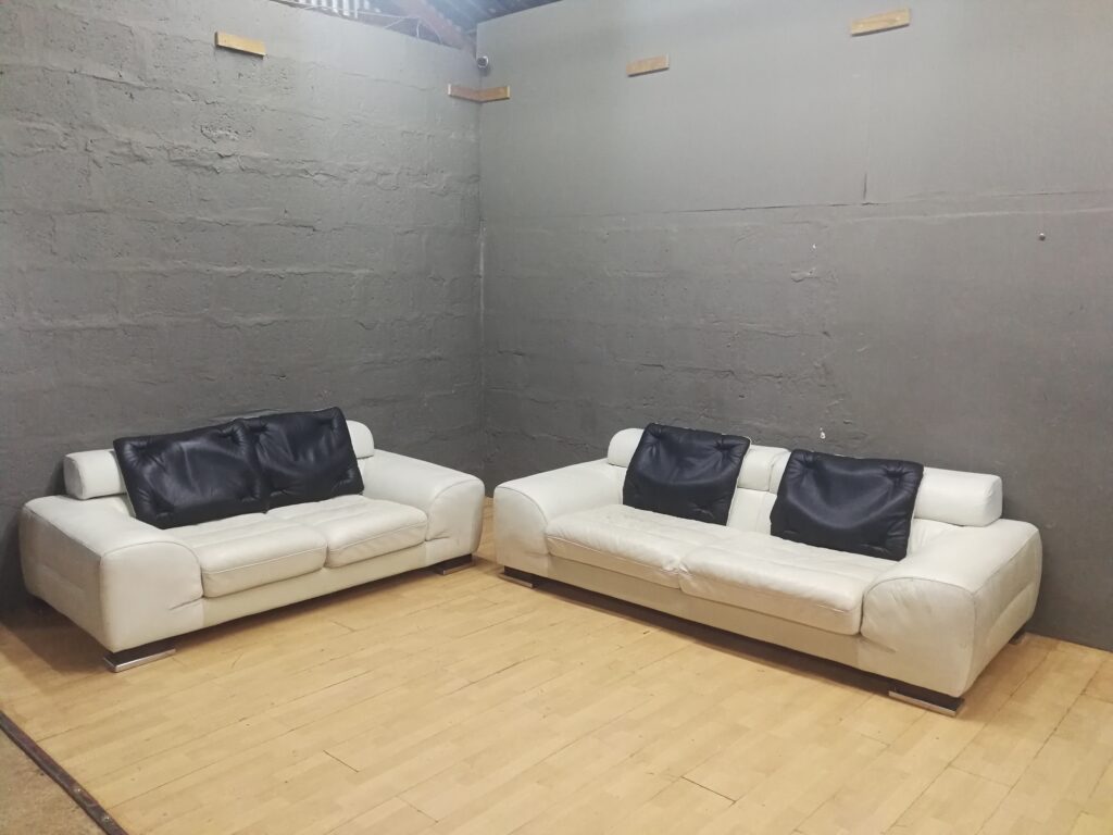 Pair of Off-White Upholstered Sofas (Set of 2) with 2 Loose Black Cushions