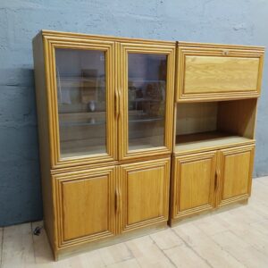 Two-module light-oak display/storage cabinet with glass doors & shelves