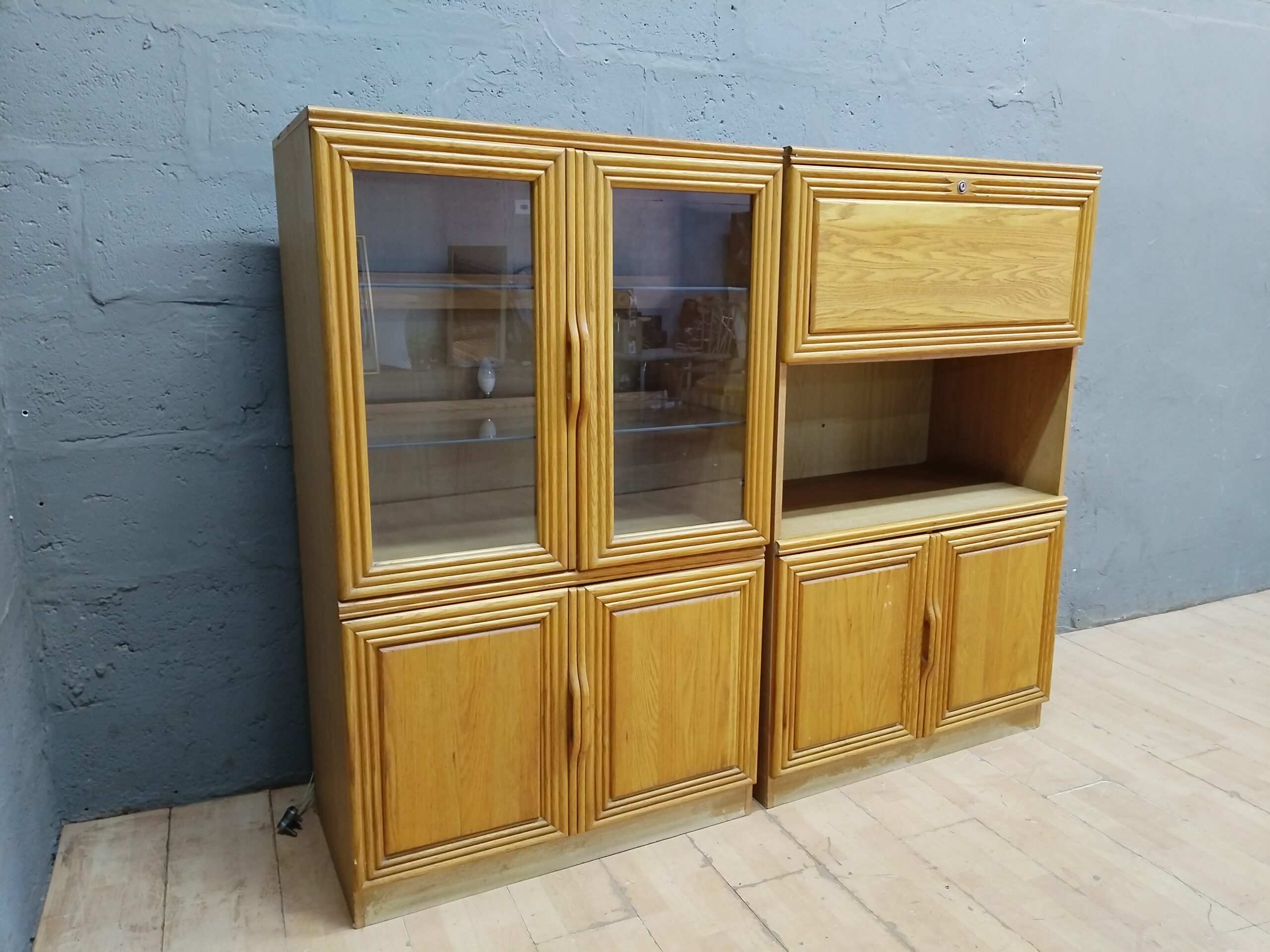 Two-module light-oak display/storage cabinet with glass doors & shelves