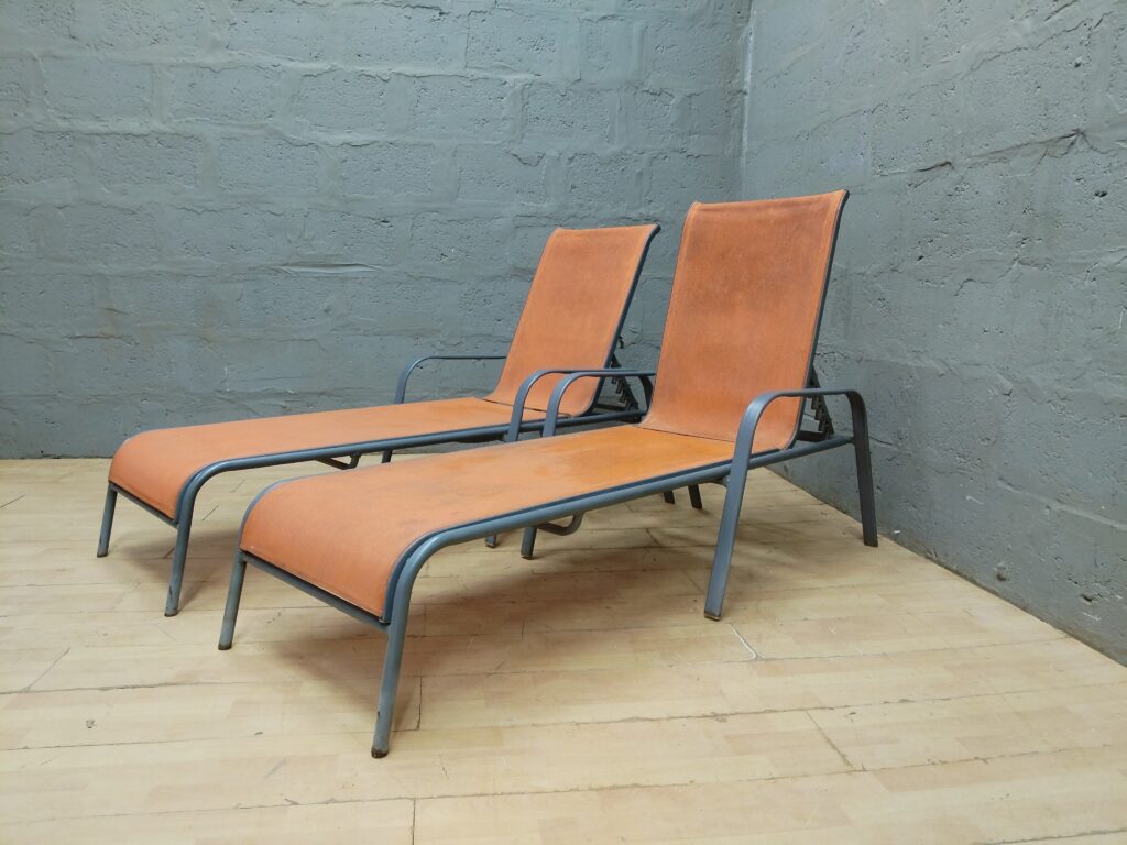 Pair of Orange Sling Outdoor Sun Loungers with Grey Tubular Frames